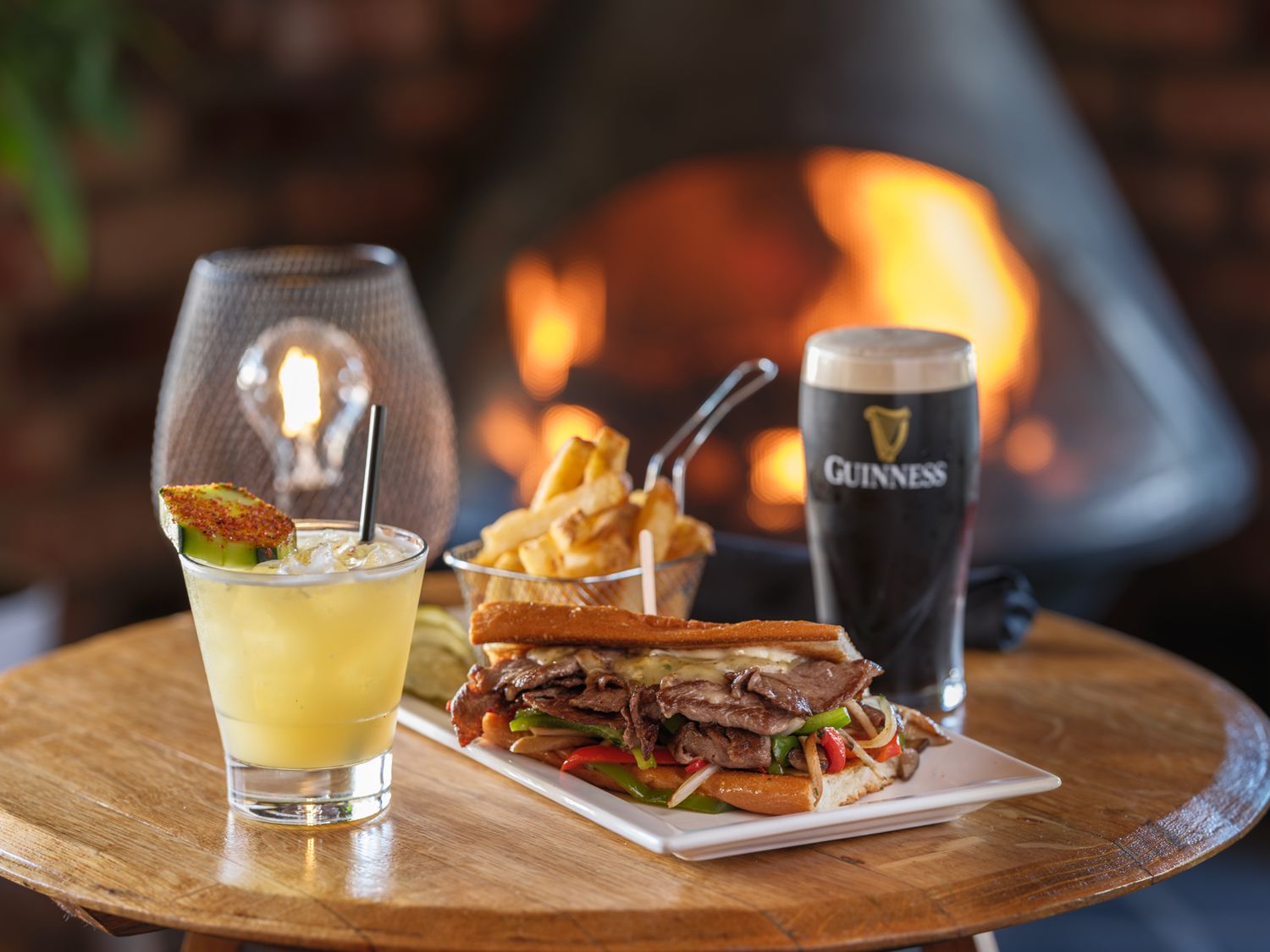 Philly cheesesteak sandwich with fries and Guinness at O'Callaghan's Irish Pub